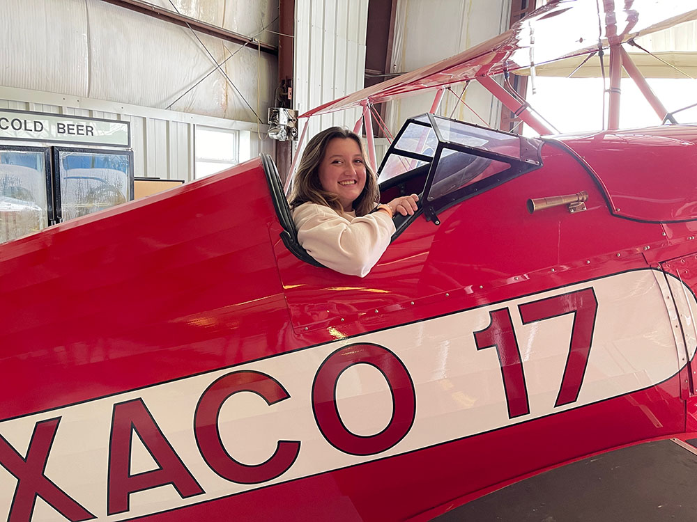 teenage girl smiling from cockpit of the texaco 17